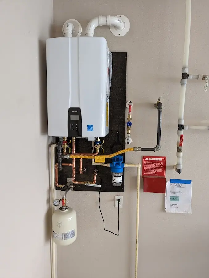 Professional plumber installing copper piping in a Dillon home